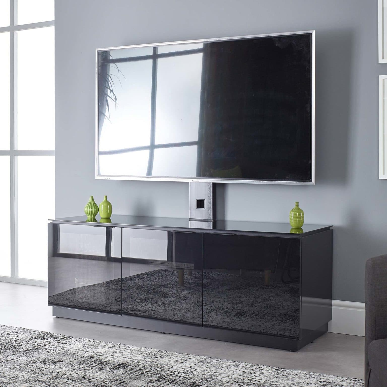 Black TV with mount for up to 65 inch TV MMTD1500XArm